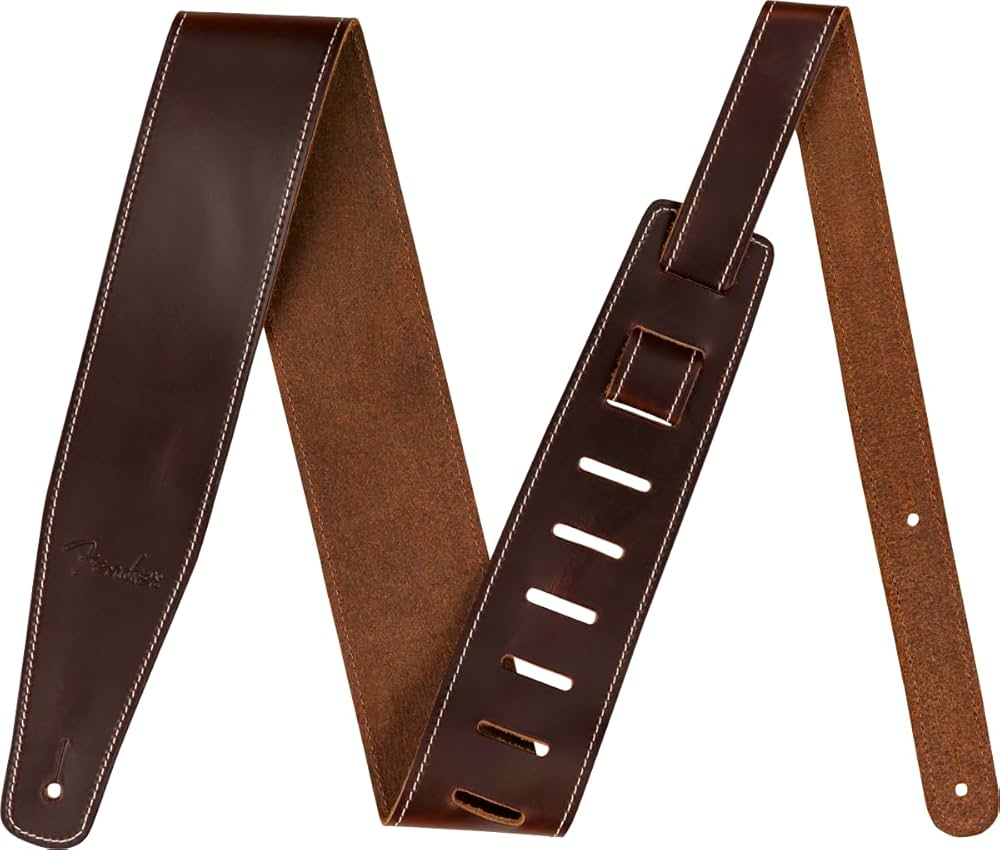 Fender's 2.5" Leather guitar strap offers a luxurious and comfortable feel. The sturdy genuine leather top sports an elegant oil finish while the backing is crafted from 5oz. cowhide leather. This strap adjusts from 44.5" to 53" long, making it ideal for guitarists of any height. Features 2.5"-wide guitar strap Crafted from oil leather Adjustable sizing from 44.5" to 53" Made in Canada
